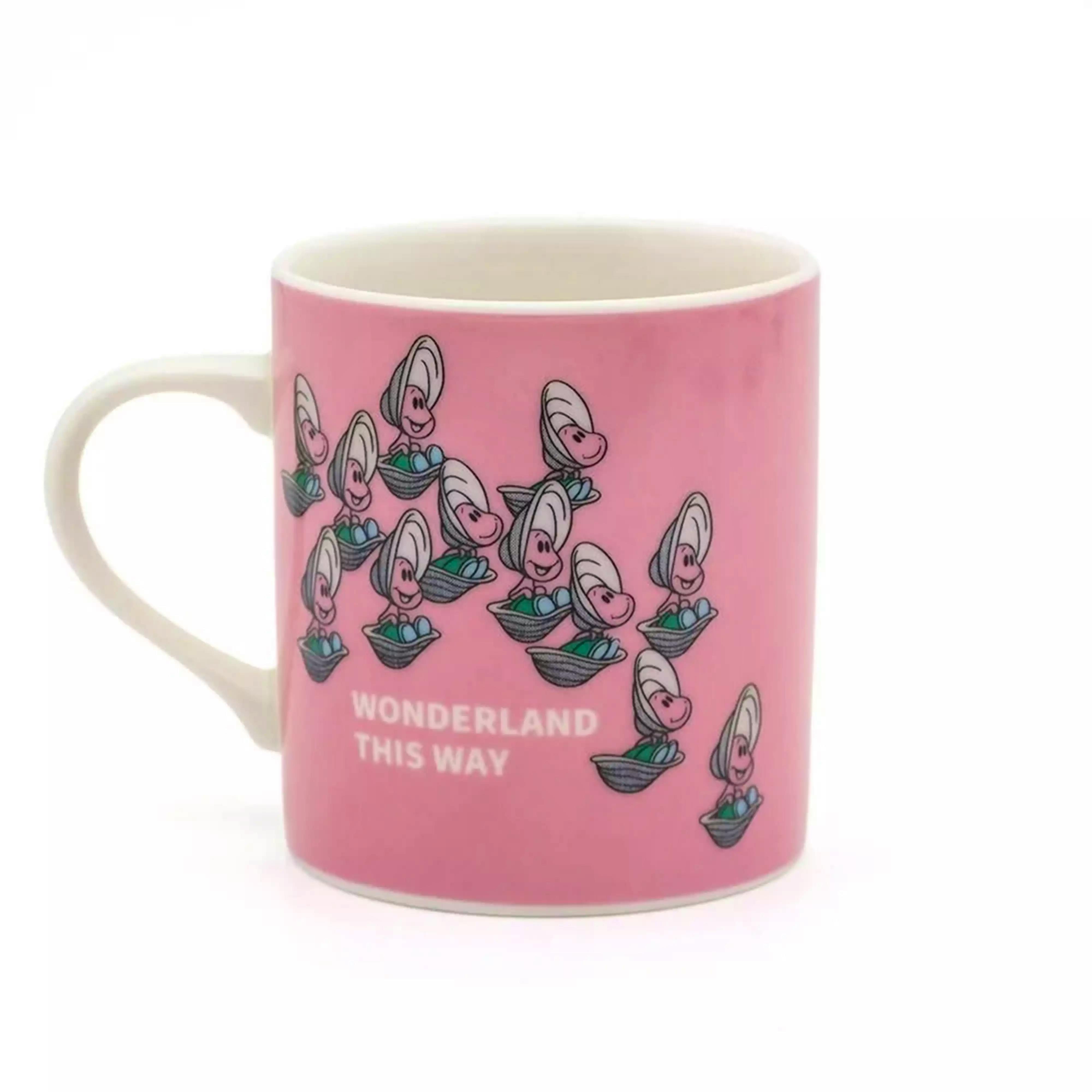 Pink ceramic mug with repeating smiling oyster illustrations and a white handle on a white background.