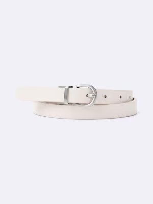 A reversible synthetic leather belt in light beige with a silver rounded buckle displayed on a white background.