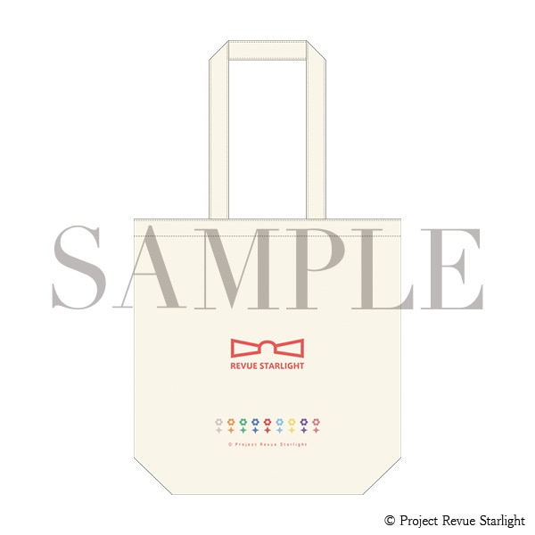 Cream-colored reusable tote bag with long handles, featuring a red bow logo above the text "REVUE STARLIGHT" and a row of small colorful icons across the front.