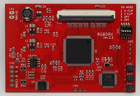 Red printed circuit board labeled "RGBDRV rev.2.2" with a central integrated circuit and visible connectors.