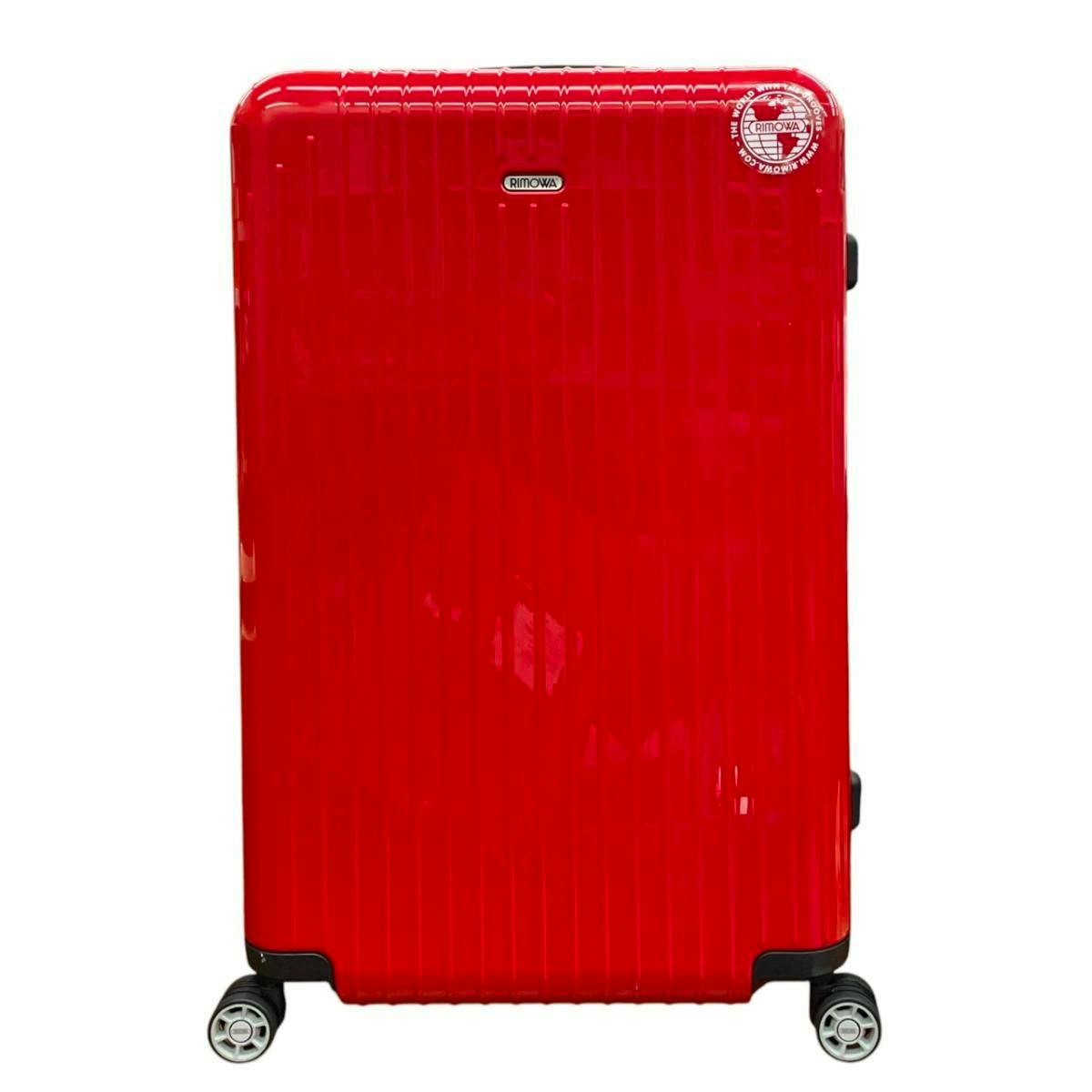 Front view of a red RIMOWA Salsa Air multiwheel hard-shell suitcase.
