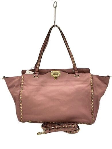 Front view of a pink leather Rockstuds tote bag with gold pyramid studs and a detachable shoulder strap.