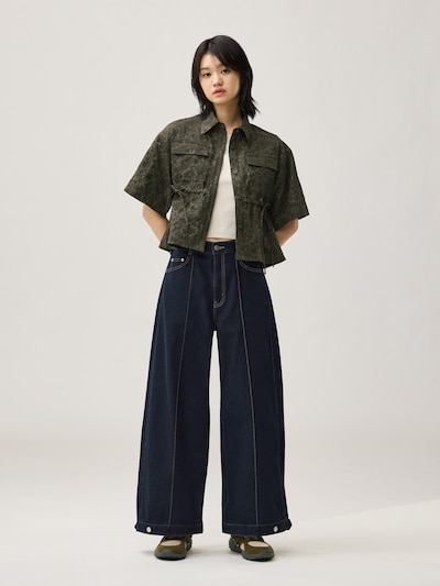 A model wearing the navy Balloon Pants by rokh shown full-length against a plain background.