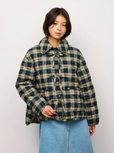 Model wearing the padded quilted check-pattern blouson jacket in green and cream.