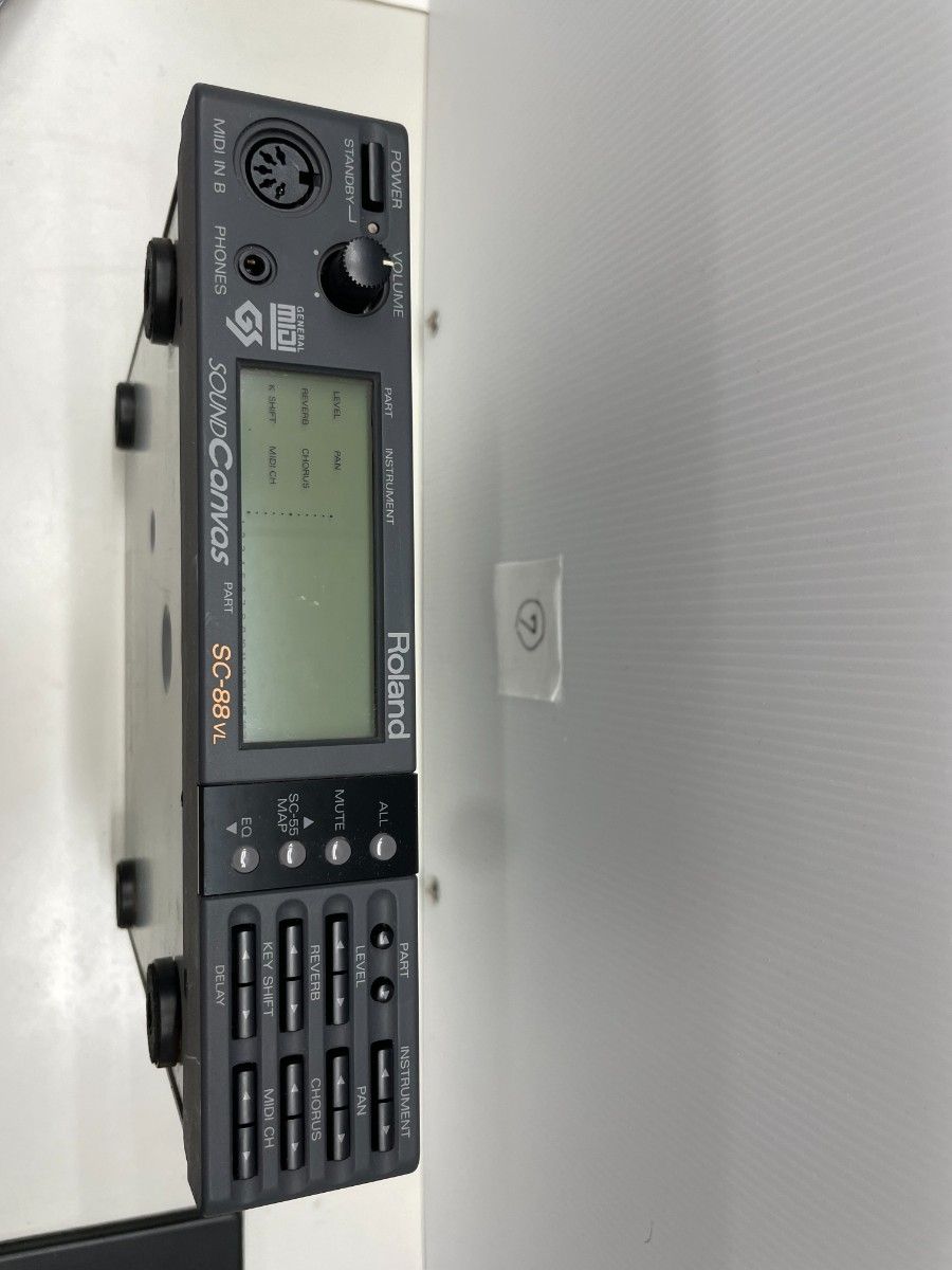 Front panel of a Roland Sound Canvas SC-88VL MIDI sound module showing the display, buttons, headphone jack, and volume knob.