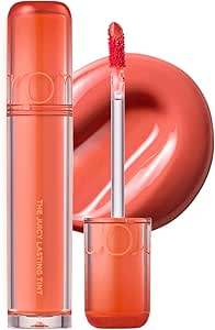 A Rom&nd The Juicy Lasting Tint (11 Papaya Jam) tube with applicator wand and a glossy swatch behind it.