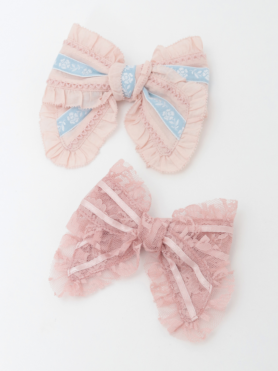 Two polyester lace ribbon bows in pink tones displayed on a white background.