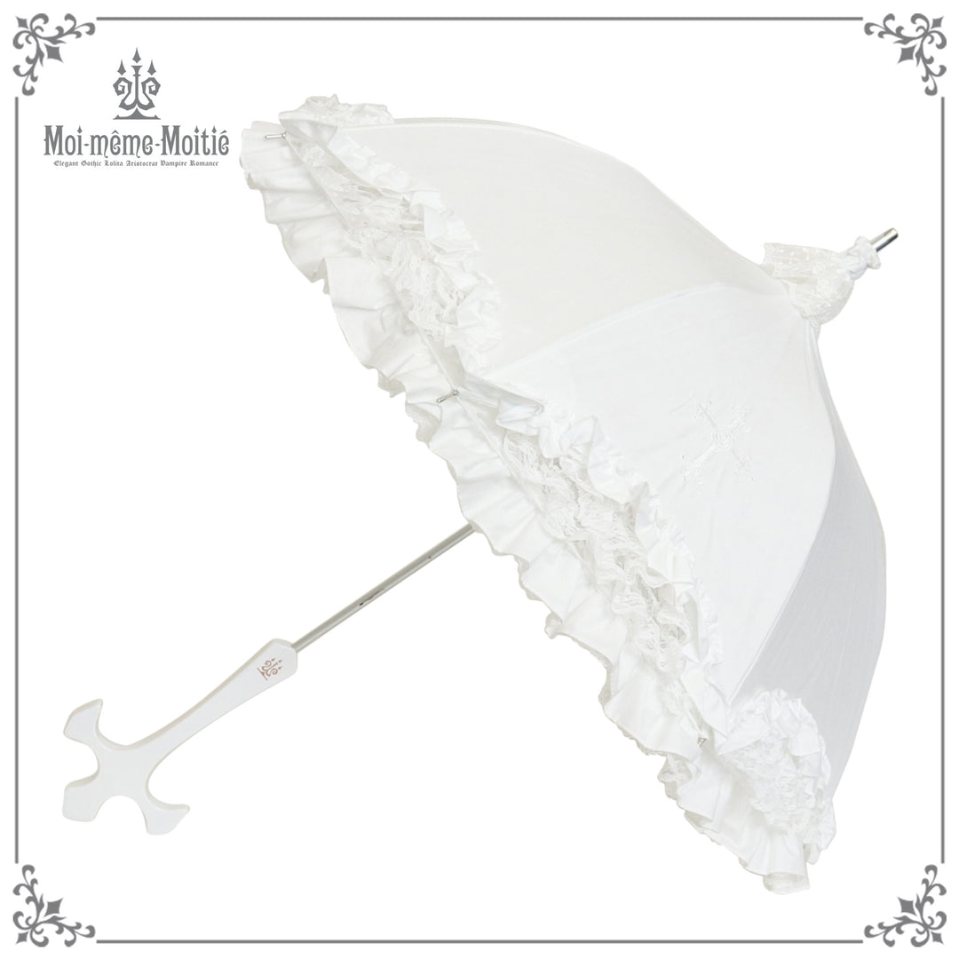 White ruffled parasol umbrella with decorative cross-shaped handle on a white background.