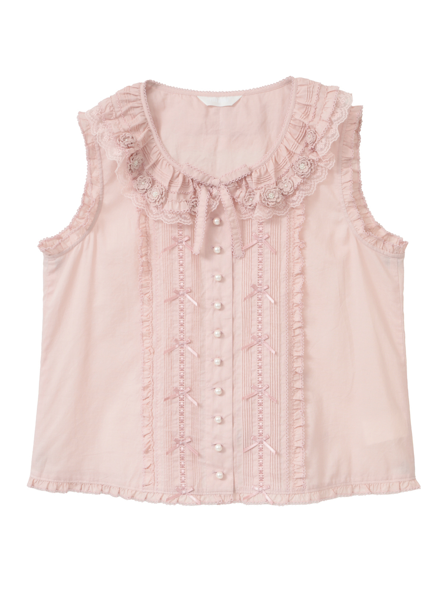 Front view of a pink sleeveless women's blouse with a ruffled rose-motif collar, vertical ribbon trims, and pearl buttons.