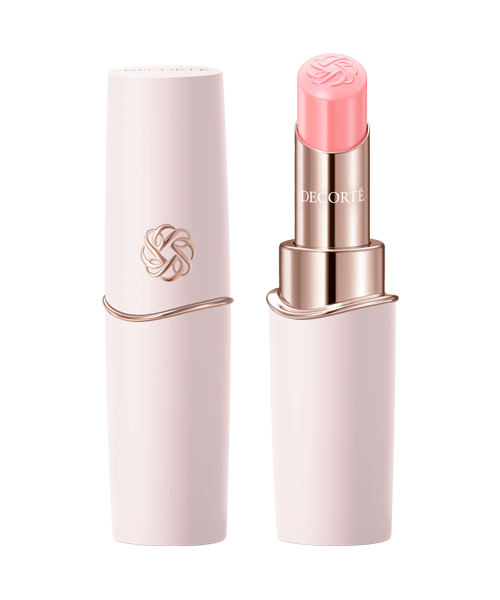A pink lipstick with its cap beside it displayed against a black background.