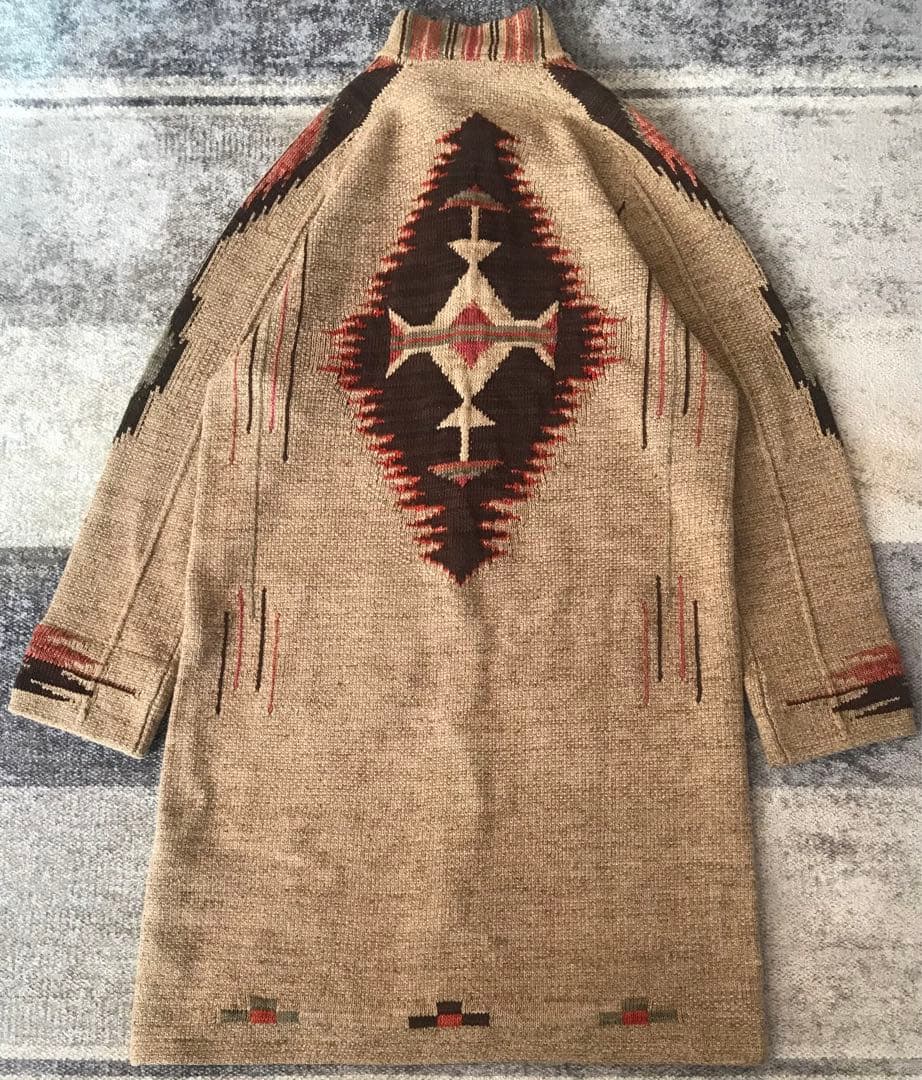 Back view of the women's silk knit gown with Navajo/Chimayo native pattern laid flat.