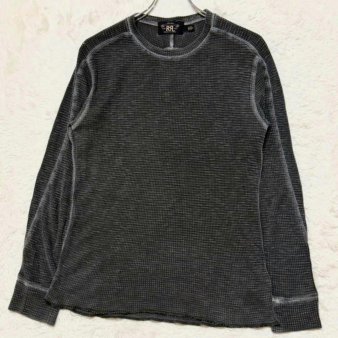 Black long-sleeve thermal T-shirt laid flat on a white background with its hanger visible at the collar.