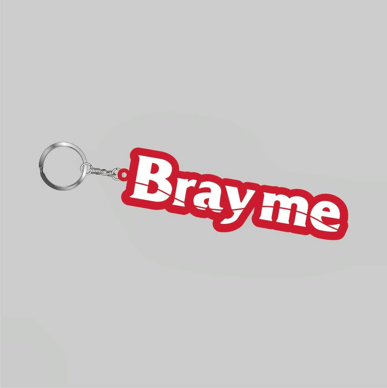 A red and white rubber keychain reading "Brayme" attached to a metal split ring and short chain on a gray background.