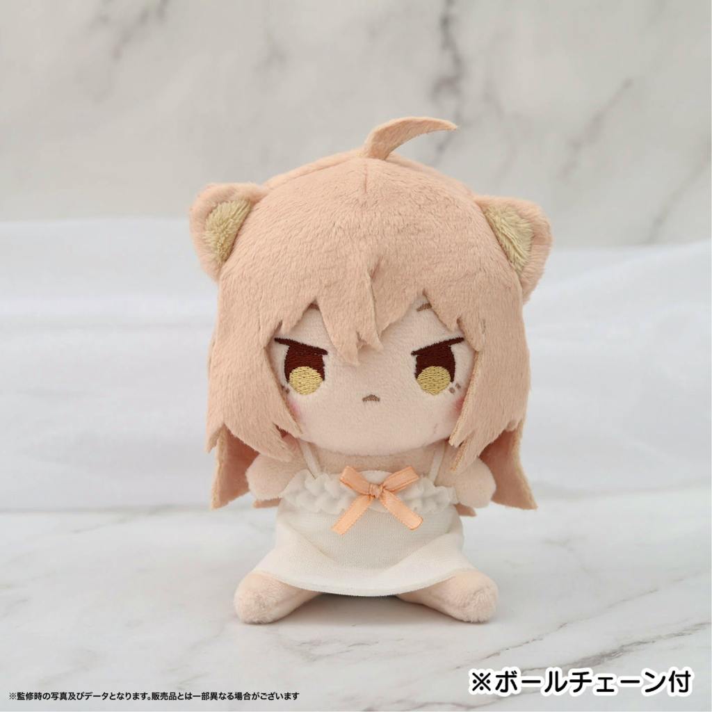Front view of the るるどらいおんmini plush in its white dress with a small peach bow, seated on a light marble surface.