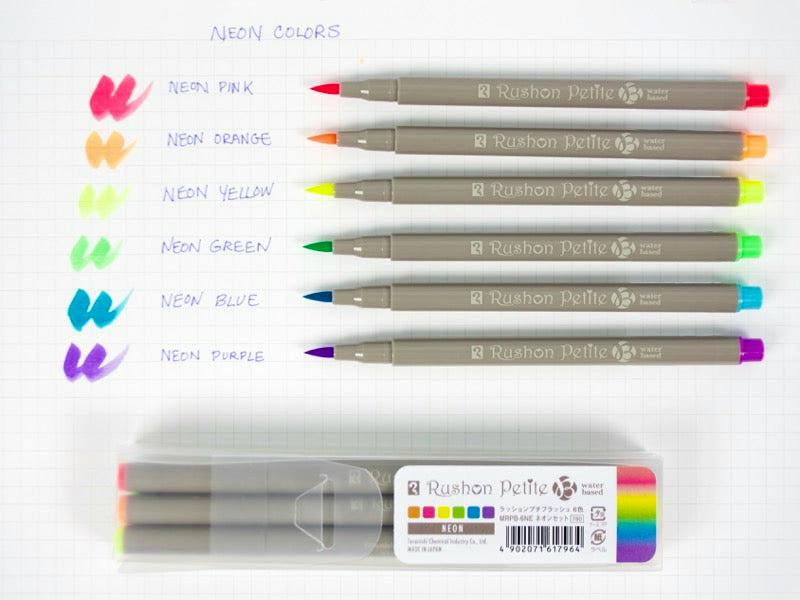Six Rushon Petite brush pens in neon colors arranged on grid paper with matching color swatches and the clear product case below.