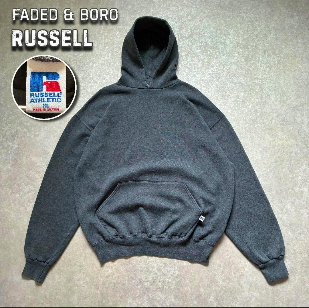 Charcoal gray Russell cotton hoodie laid flat showing the hood, kangaroo pocket, and a small brand tag.