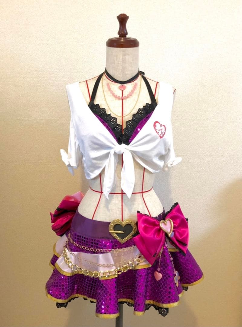 Mannequin wearing the cosplay women's swimwear set with a white tied top and a purple skirt with a large pink bow.