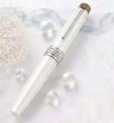 A white pearlescent fountain pen with a capped barrel, metal clip, and decorative rings on a light background.