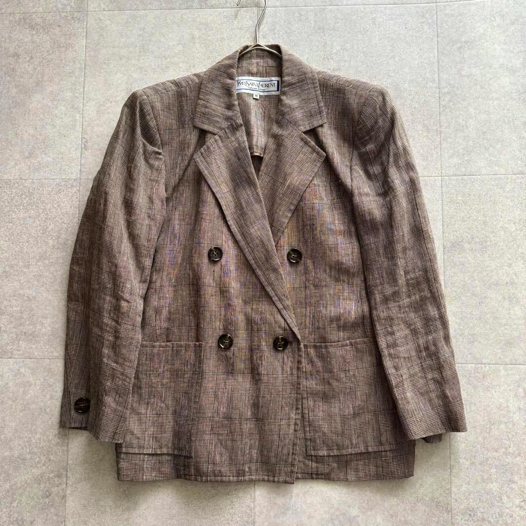 Front view of the Saint Laurent double-breasted checked linen jacket (100% linen, size M) hanging on a hanger.