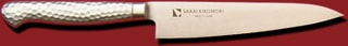 Stainless steel petty knife (18 cm) showing blade and textured handle on a red background.
