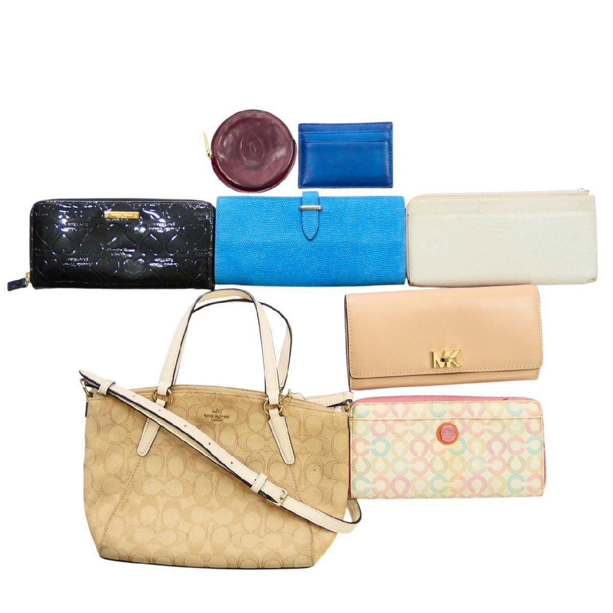 Beige Coach 2way tote bag displayed with seven wallets and small cases arranged above it on a white background.