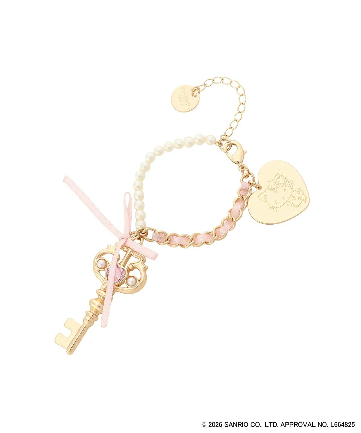 Photo of the Charmy Kitty key-motif bag charm in a gold finish with a pink ribbon, faux pearl beads, chain, and a heart-shaped engraved tag on a white background.