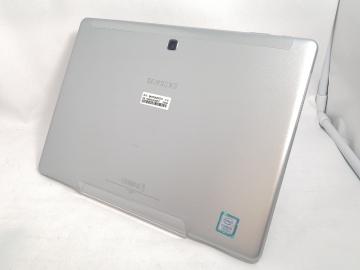 Silver SAMSUNG Galaxy Book 12.0 tablet shown from the rear with camera and manufacturer stickers on a white background.