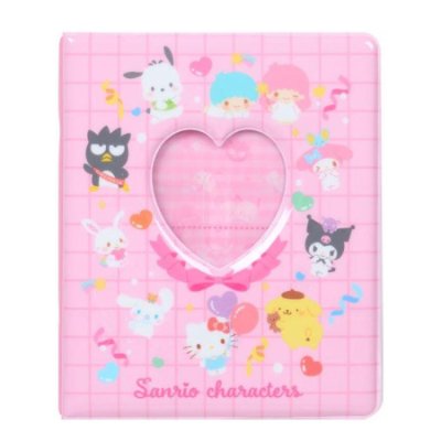 Front of a pink Sanrio character L-size photo pocket album with a heart-shaped clear window and character illustrations.