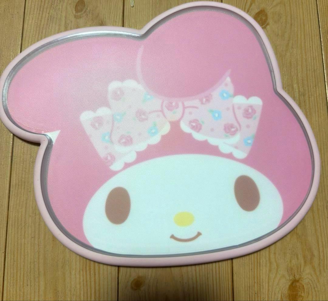 Pink My Melody-shaped reversible plastic cutting board showing the character's face on one side.