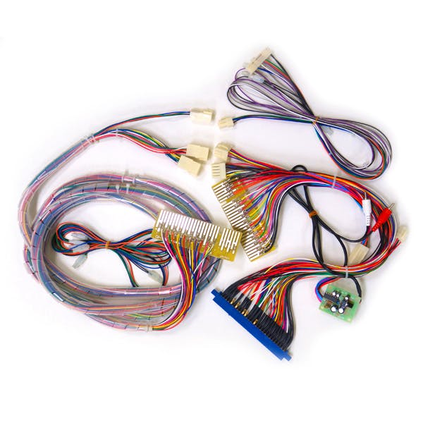 Photo of a communication harness for JAMMA and JVS showing multicolored wires, connectors, and a small circuit board.