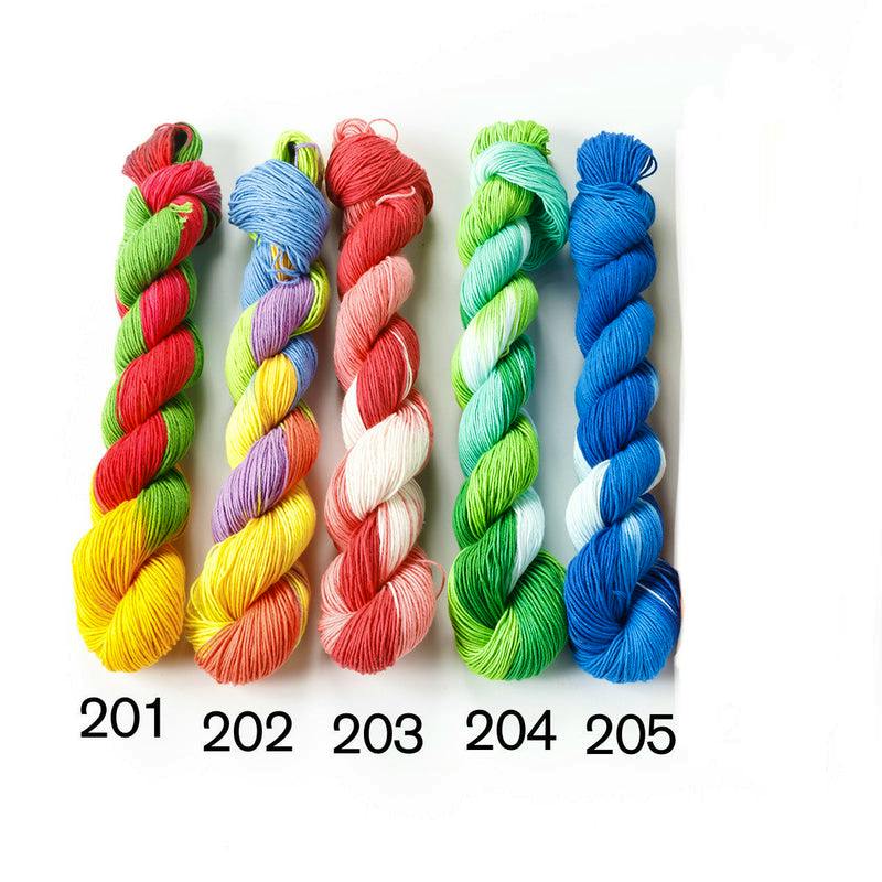 Five twisted skeins of variegated cotton sewing thread labeled 201–205 on a white background.