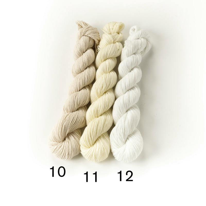 Three skeins of white-toned sashiko cotton thread labeled 10, 11, and 12 on a white background.