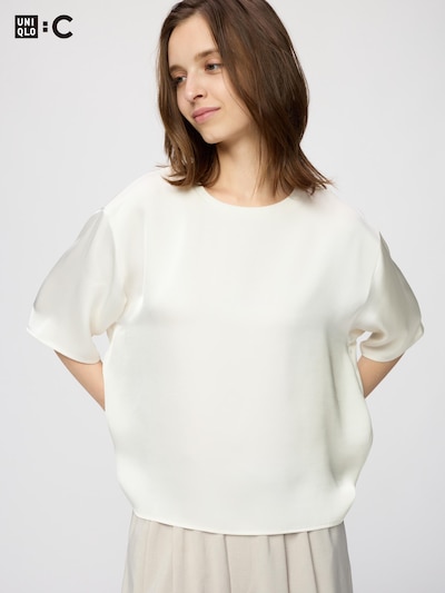 Model wearing a white satin oversized short women’s blouse with five‑minute (5分袖) sleeves, shown from the front.