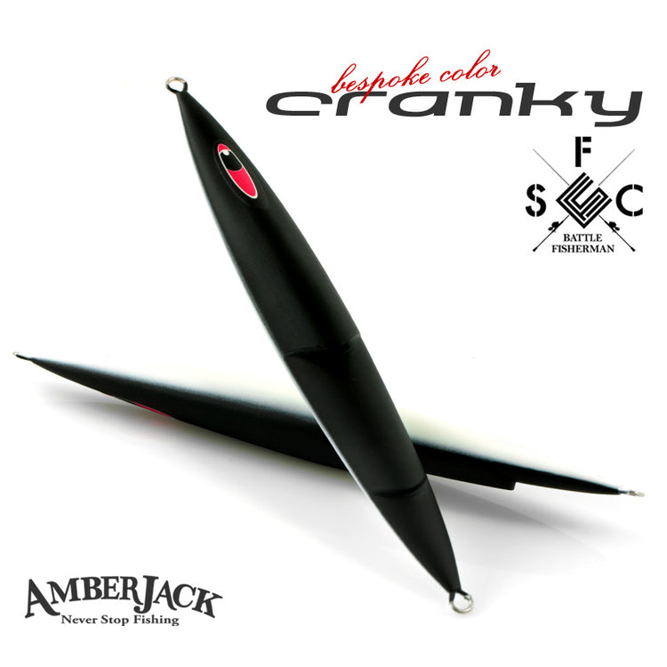 Two matte black Seafloor Control Cranky fishing lures on a white background.