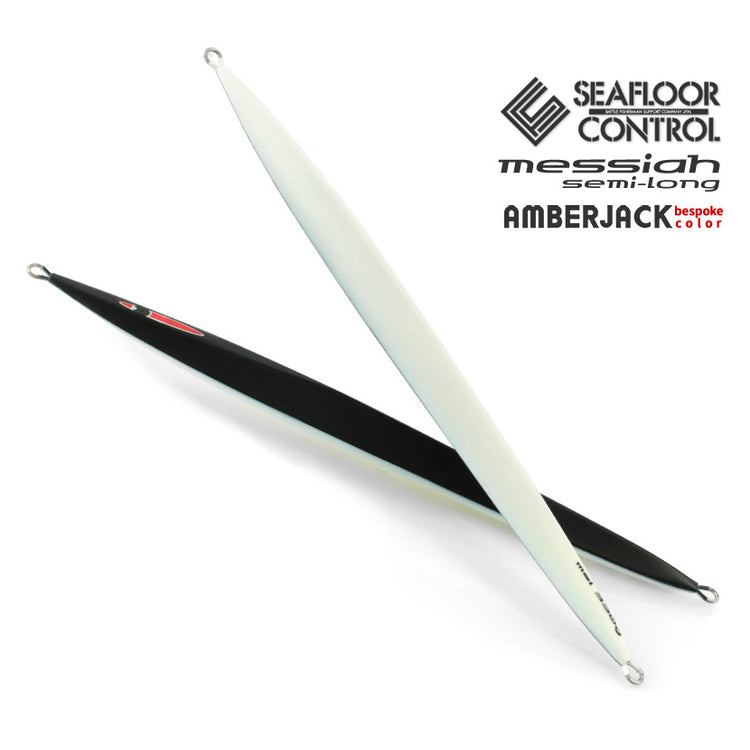 Two SEAFLOOR CONTROL Messiah semi-long fishing lures in black and white shown crossed on a white background.