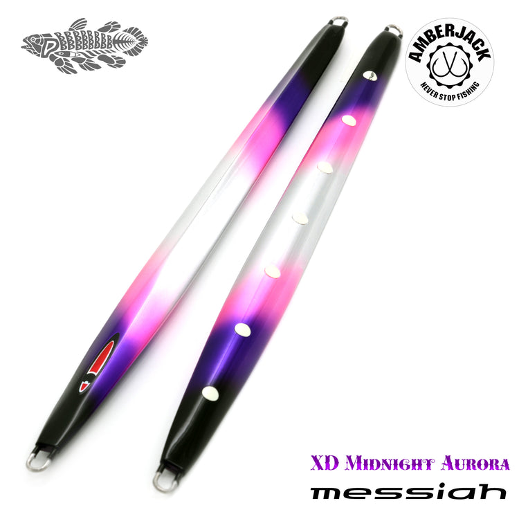 Two elongated metal fishing lures (jigs) with a purple-pink gradient finish, holes, and attachment rings on a white background.