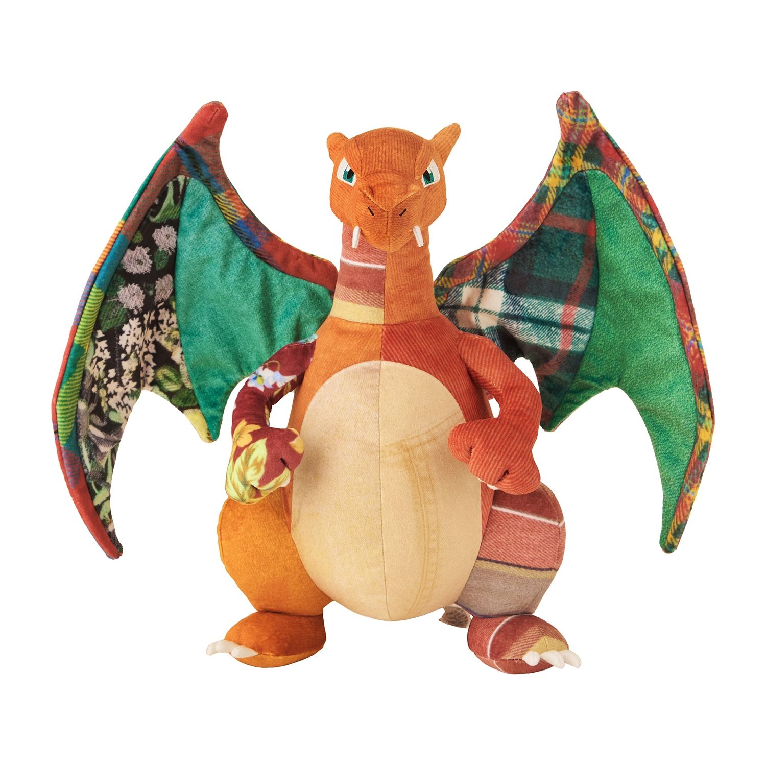 Front view of the Sean Wotherspoon × Pokémon Center Charizard plush with patchwork patterned wings and an orange corduroy-like body.