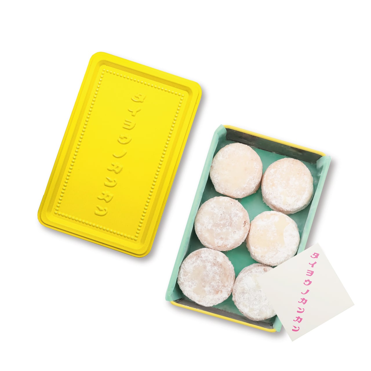 Yellow embossed rectangular tin lid next to an open tin showing six lemon polvorón cookies dusted with powdered sugar.