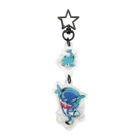 Full view of the two-piece acrylic keychain showing a black star-shaped clasp and two blue dolphin character charms.