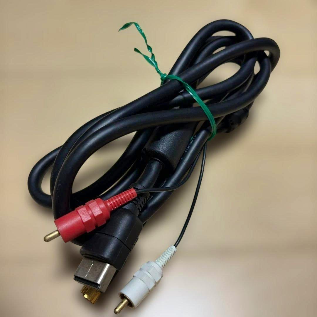 Coiled Dreamcast S-video AV cable showing the Dreamcast multi-out plug, S-video connector, and red and white RCA plugs.