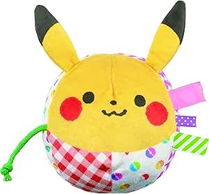Yellow Pikachu soft plush ball with embroidered face, upright ears, patterned fabric panels, and ribbon tags.