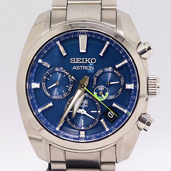 Close-up front view of a Seiko Astron GPS Solar men's wristwatch with a blue dial and metal bracelet.