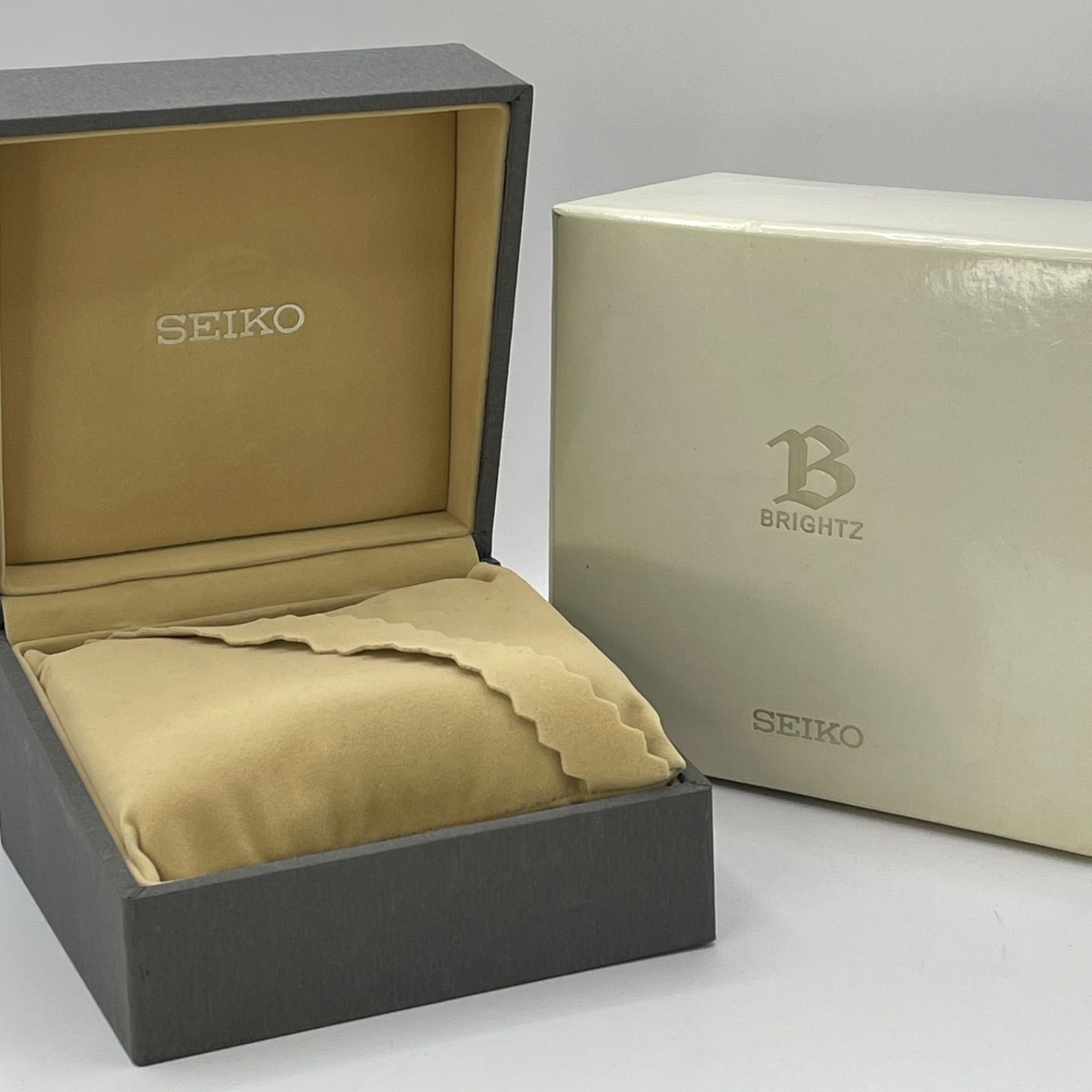 Open SEIKO Brightz watch presentation box with beige pillow and a white outer box visible.