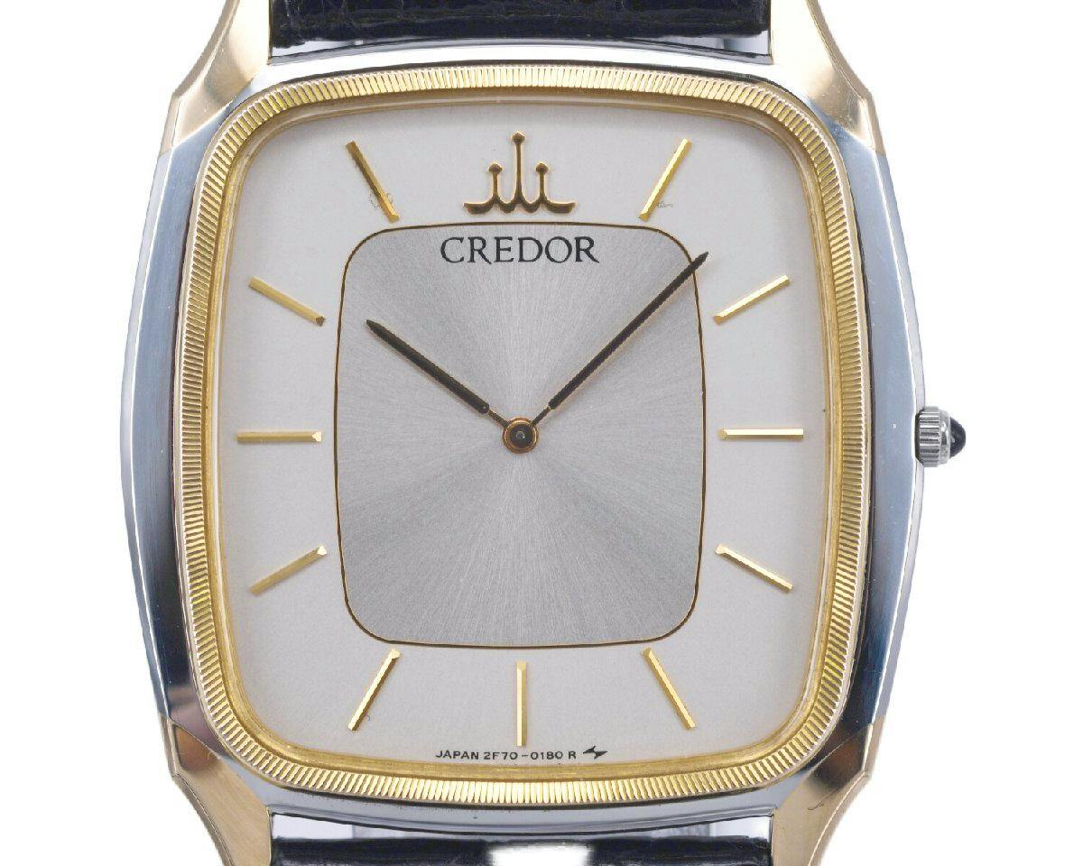 Close-up of the SEIKO Credor watch face showing the silver dial, gold bezel and gold hour markers.