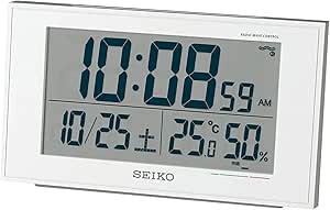 Front view of a Seiko digital clock with a large LCD display showing time, date, temperature, and humidity in a white frame.