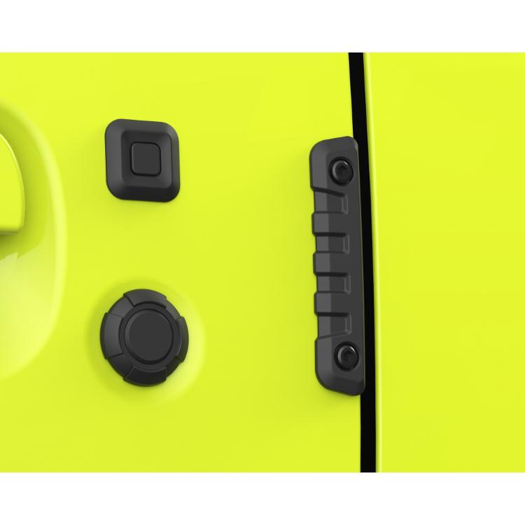 Close-up photo of a black door edge/door guard (Toughness Protector) installed on a yellow car door.