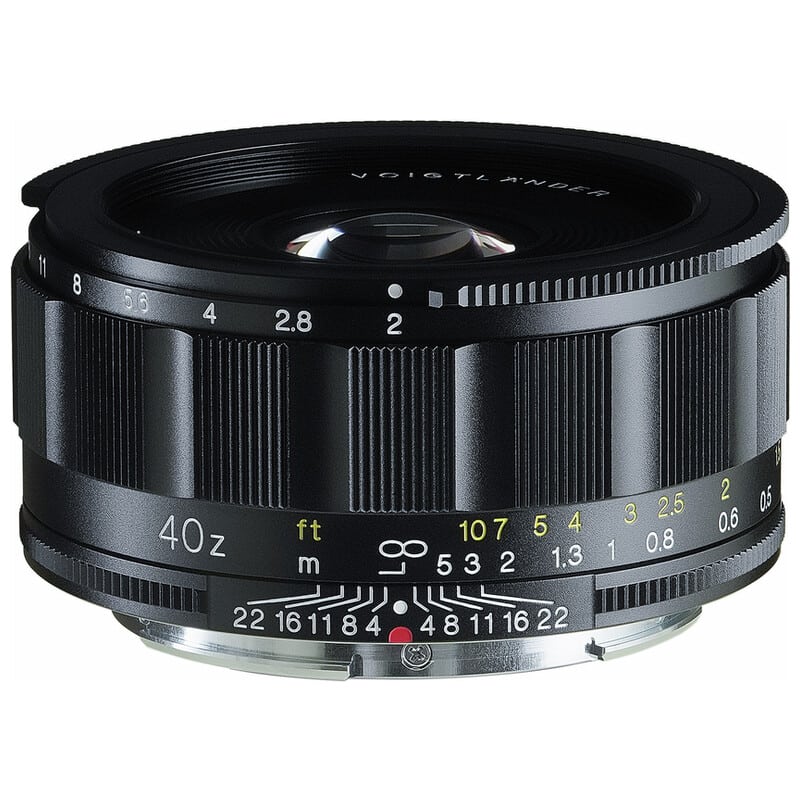 Black SEPTON 40mm F2 Aspherical Z-mount camera lens photographed from a three-quarter front view showing focus and aperture markings.