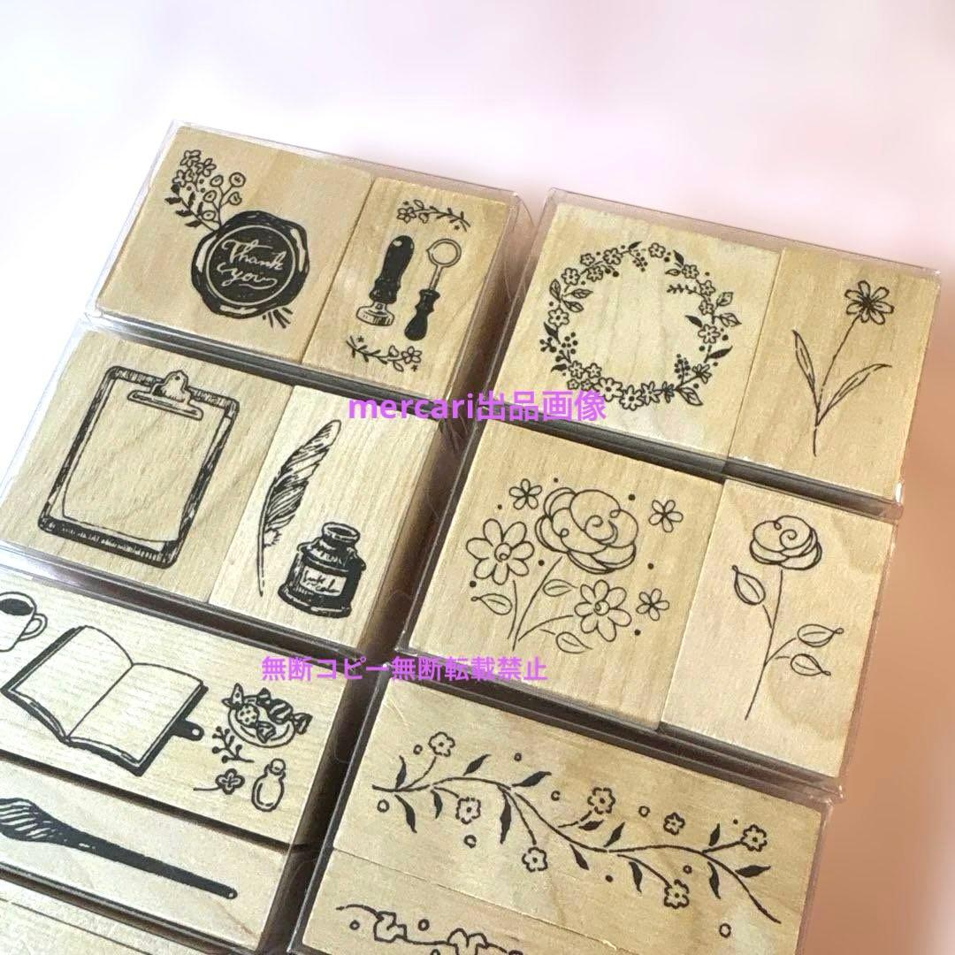 Close-up photo of wooden rubber stamps showing flower and antique stationery designs.