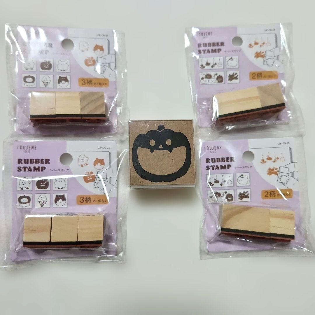 Photo of packaged Halloween rubber stamps with a loose pumpkin-face rubber stamp in the center.