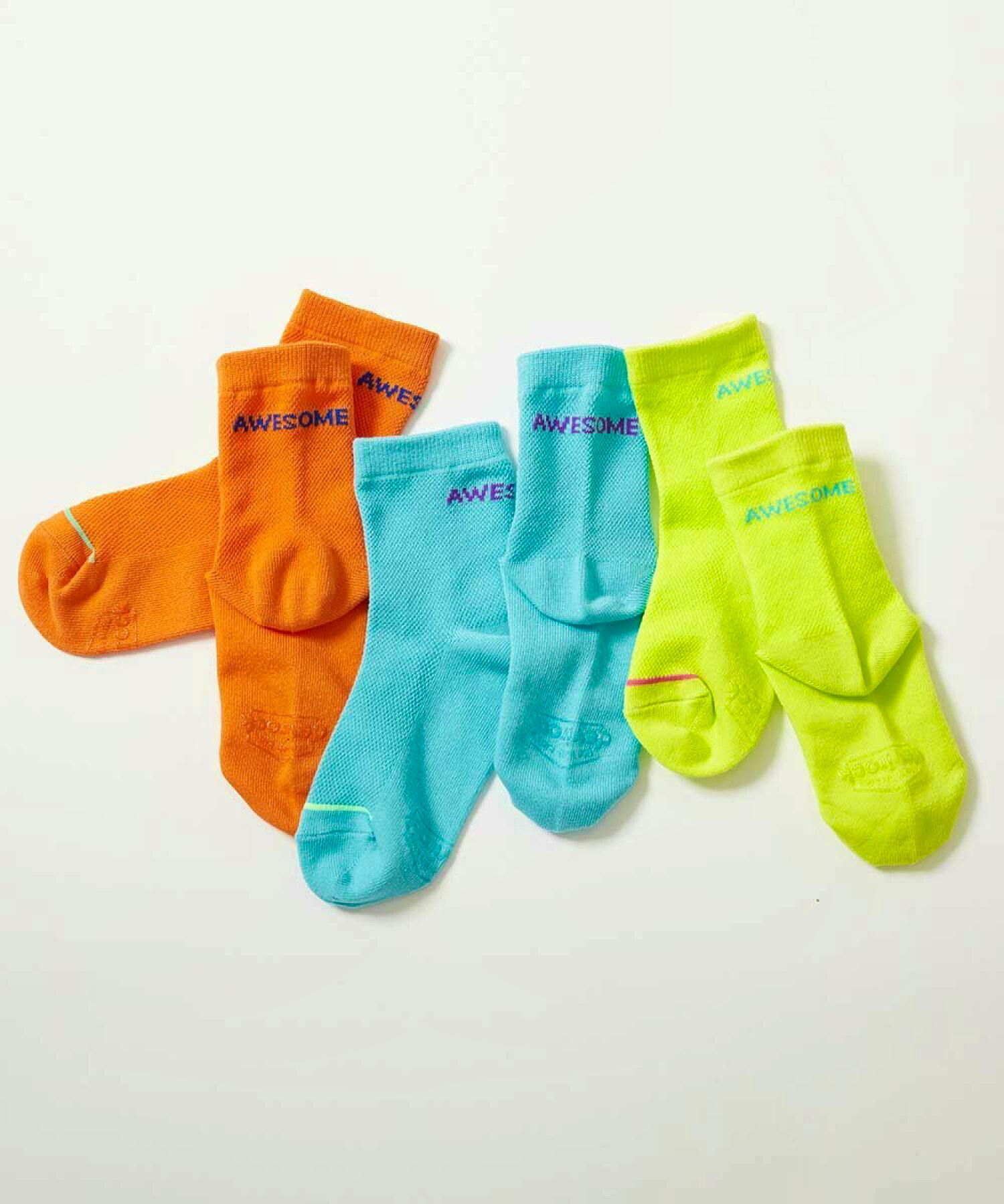 Three pairs of neon mesh short children's socks (orange, turquoise, yellow) laid flat on a white background.